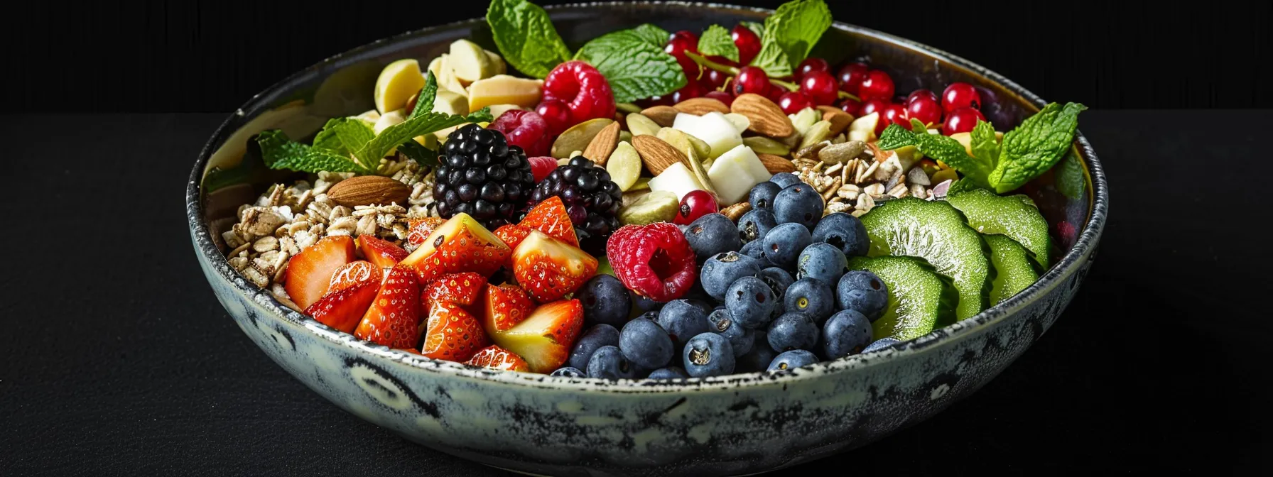 a vibrant bowl filled with colorful berries, dark leafy greens, and assorted nuts and seeds, showcasing antioxidant-rich foods for energy and metabolic health.