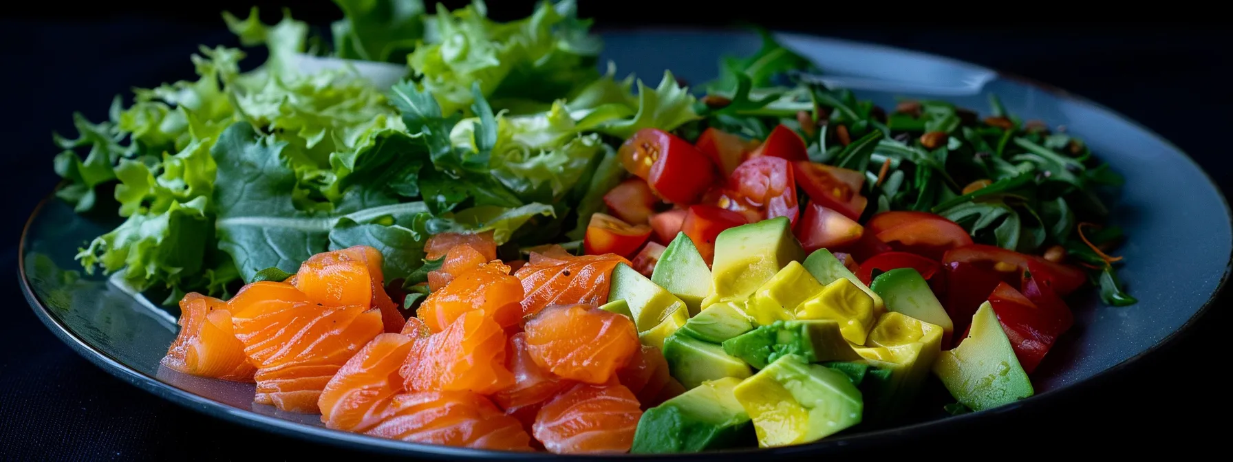 a vibrant plate filled with colorful, low-carb foods like avocado, lettuce, and salmon, symbolizing the key role of diet in rapid weight loss on the keto diet.