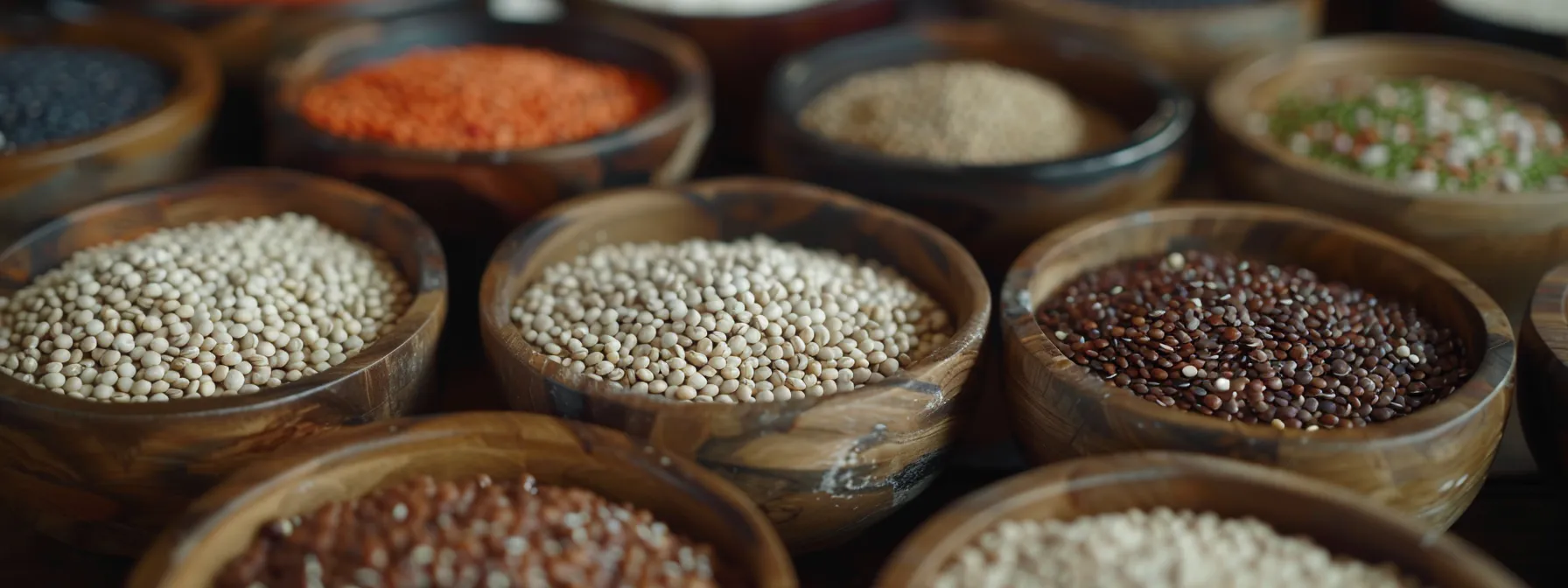 a colorful array of organic quinoa, beans, and lentils displayed in rustic wooden bowls, showcasing their high-protein and nutrient-rich benefits for a healthy waistline.